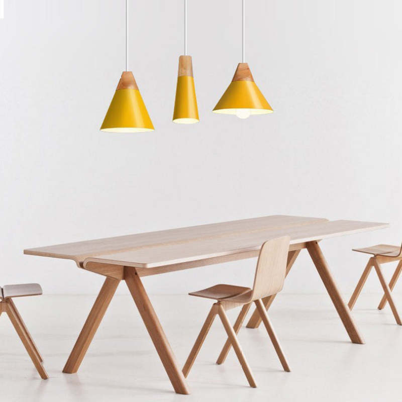 Yellow Morandi pendant lights above a dining table, Lassola lighting