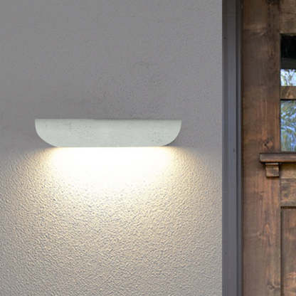 Orr Modern Curved Outdoor Wall Lamp illuminating a wall