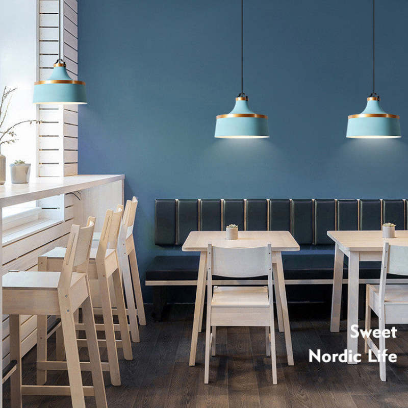 Light blue Morandi pendant lights in a Nordic style dining area