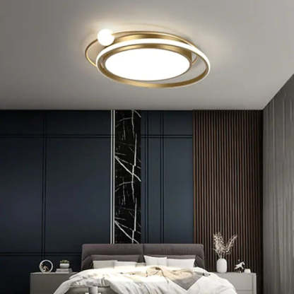 Modern gold orbit ceiling light fixture in bedroom