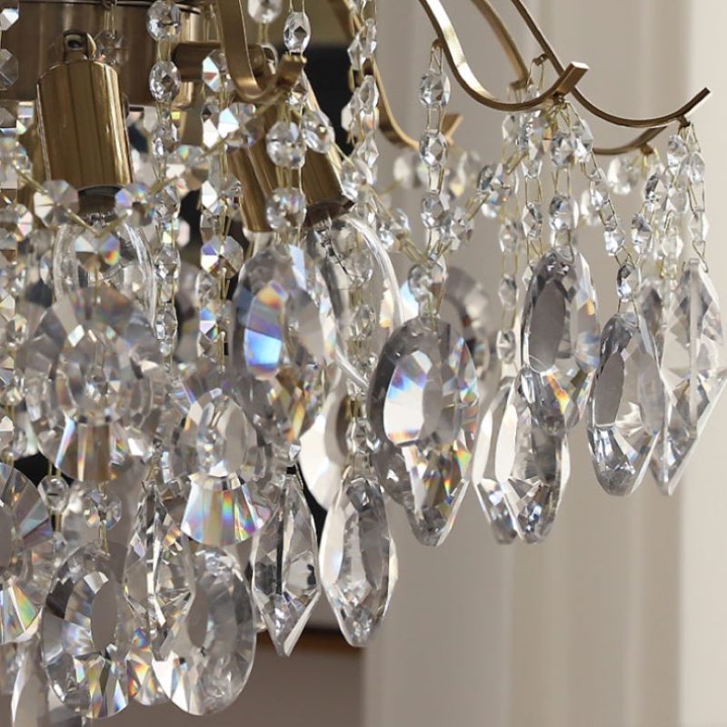 Close-up: Crystal chandelier details, metal fixture, elegant lighting