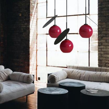 Red Valentina pendant lights in a living room setting.