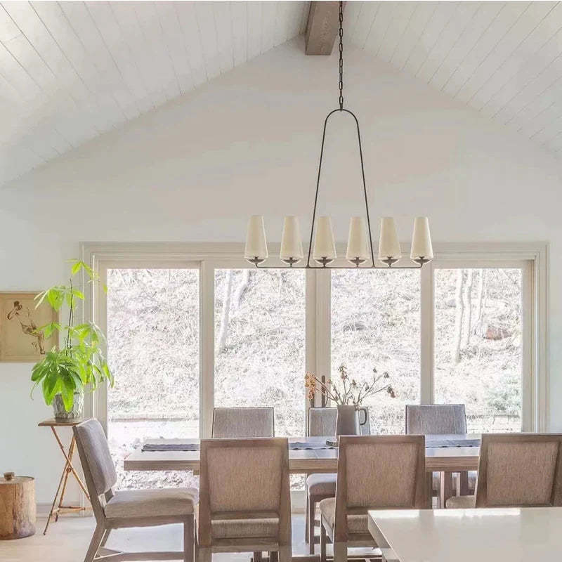 Alessio LED Chandelier illuminates dining area.