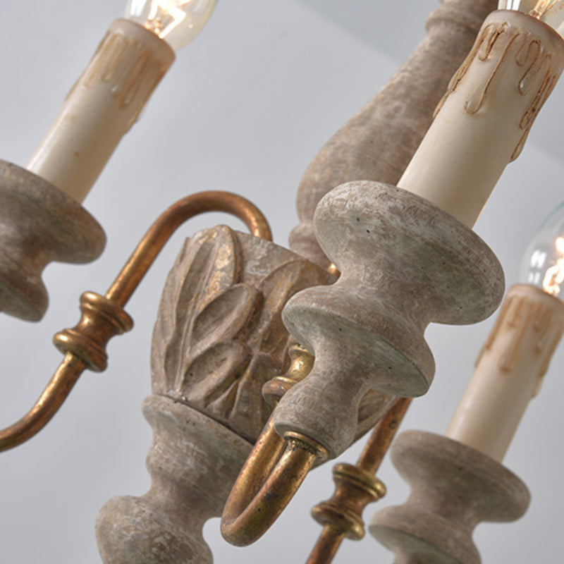 Rustic wood chandelier with candle lights detail.