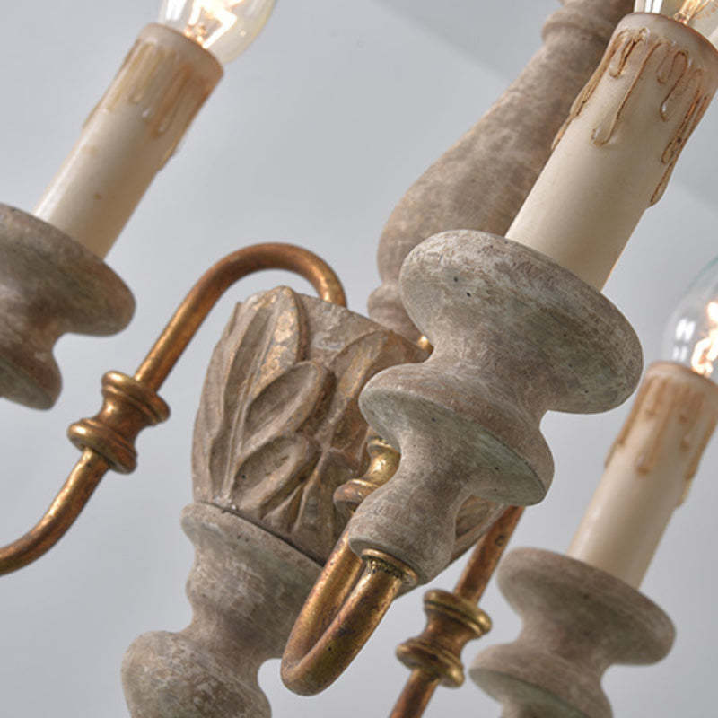 Rustic wood chandelier with candle lights detail.