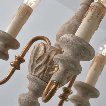 Rustic wood chandelier with candle lights detail.