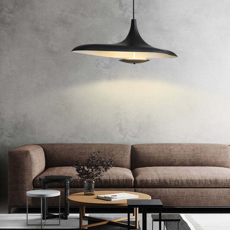 Modern black Carins pendant light illuminating living room