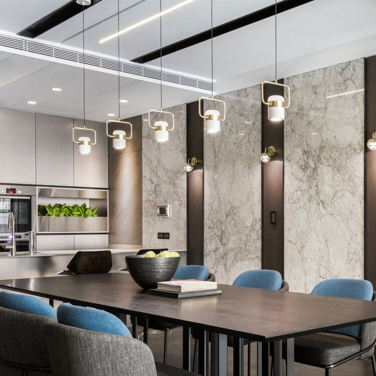 Cooley pendant lights over dining table. Modern industrial style.