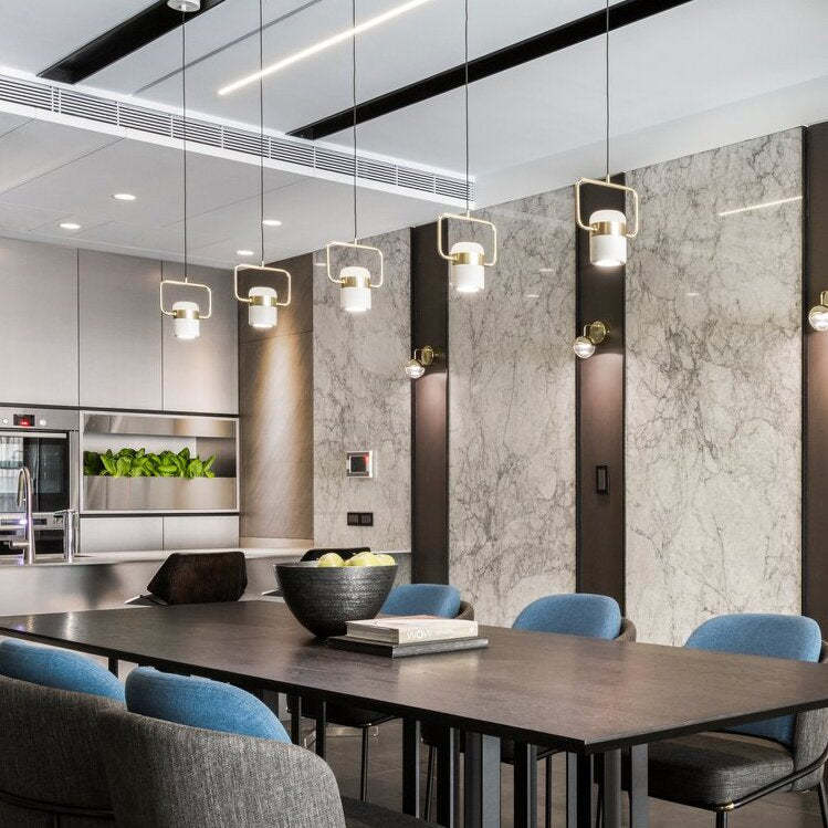 Cooley pendant lights over dining table. Modern industrial style.