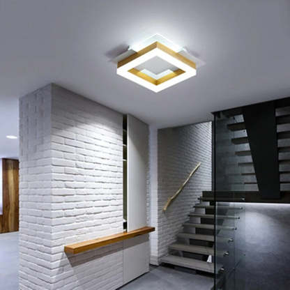 Modern square flush mount in hallway.