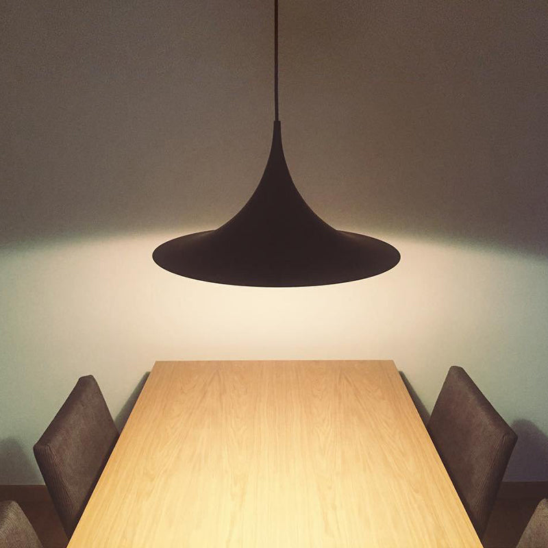 Cairns pendant light above wooden dining table