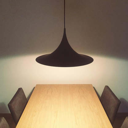 Cairns pendant light above wooden dining table