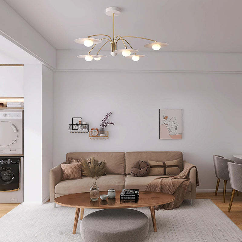 Cairns metal pendant light illuminates living room.