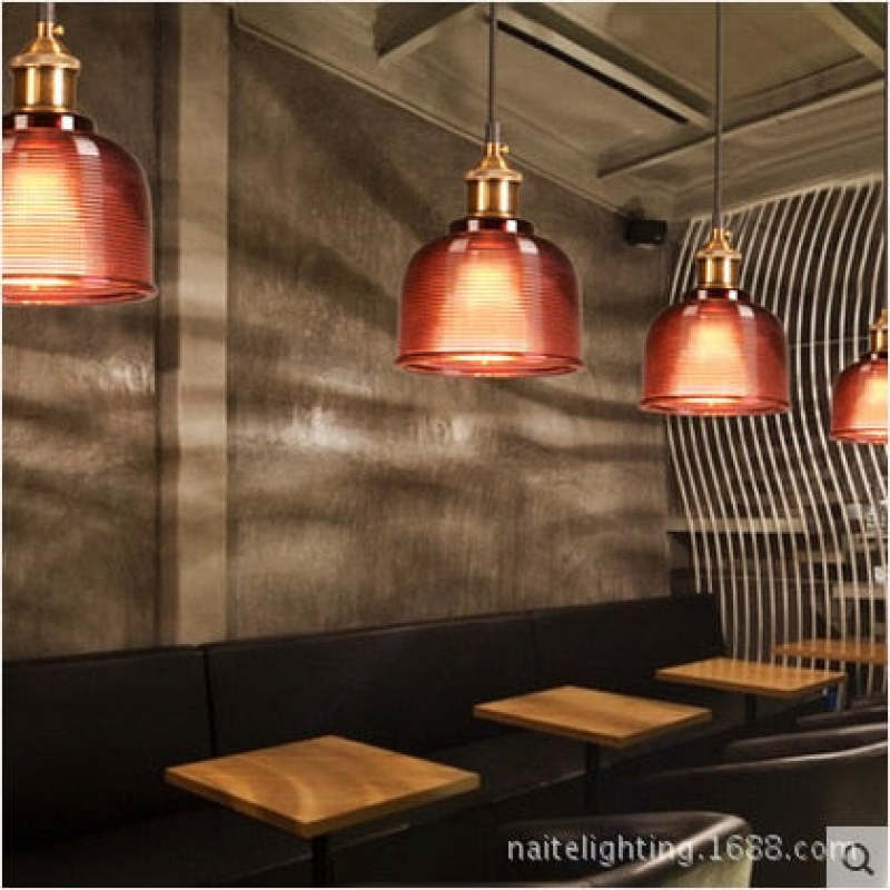 Amber glass Art Deco pendant lights in a modern setting.
