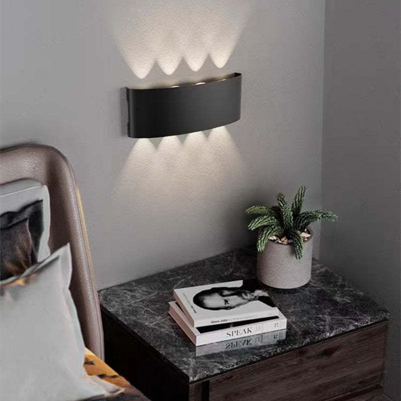 Orr modern metal wall lamp with 'SPEAK' book