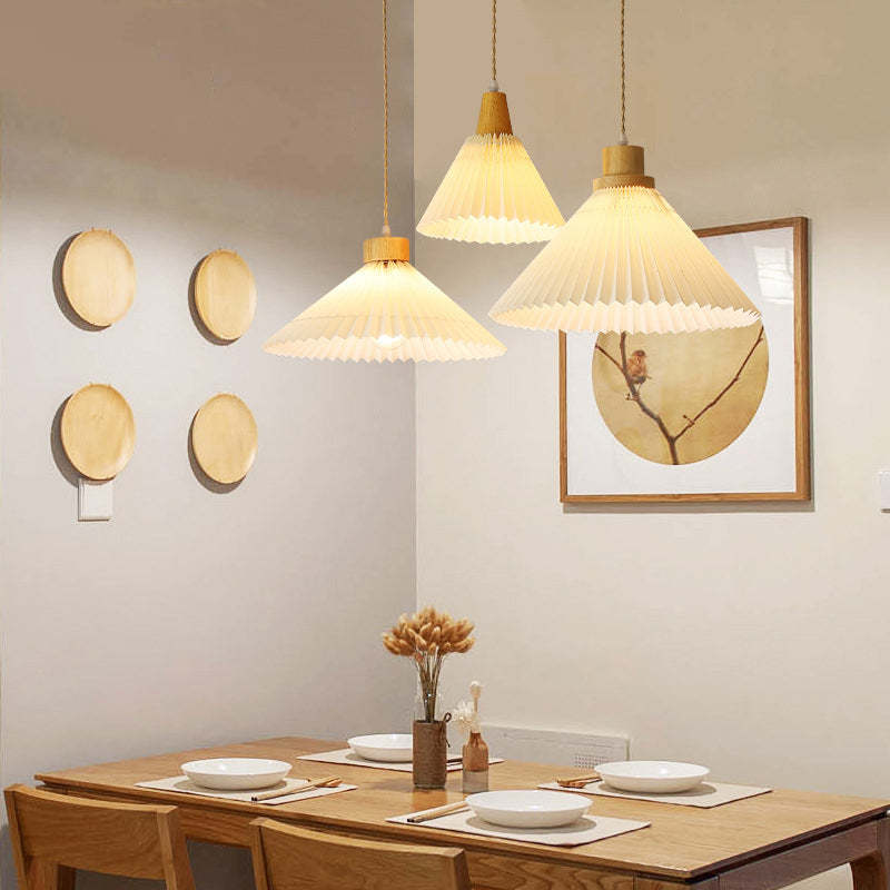 Dining room with Ozawa wood pendant lighting