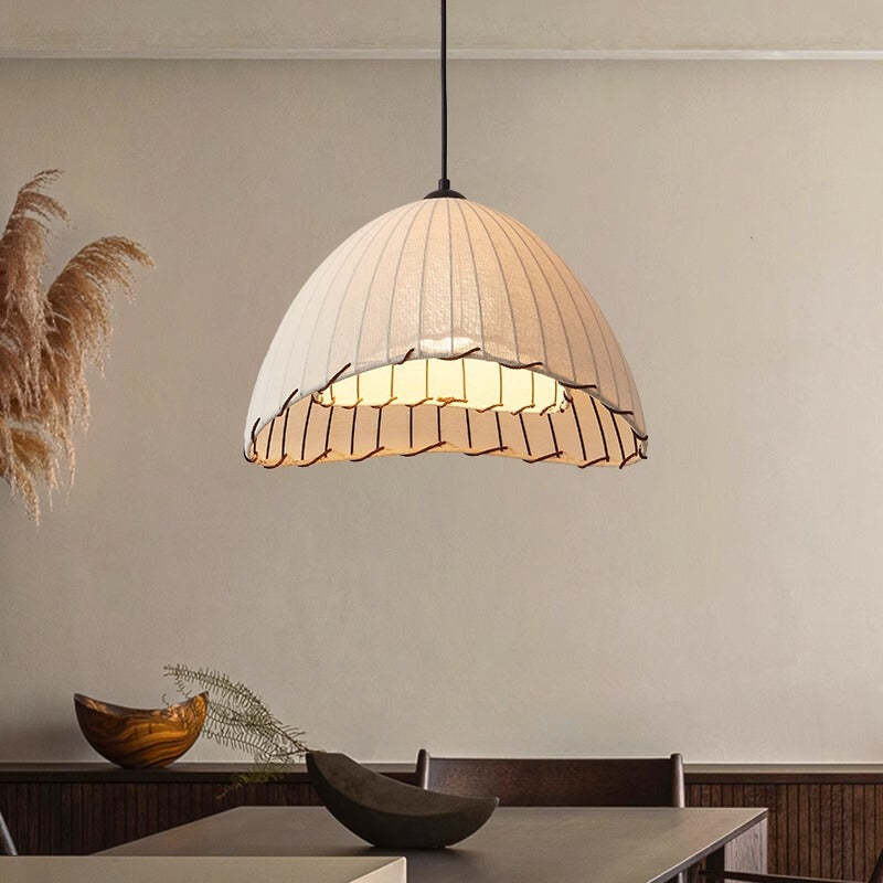 Boho pendant light in restaurant. Fabric LED light fixture.