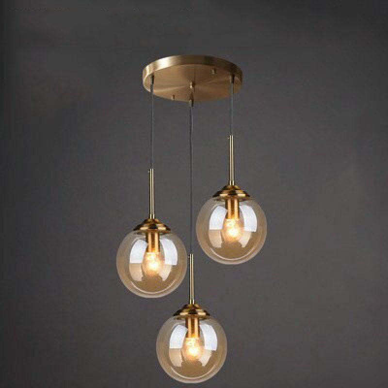 Valentina pendant light with three amber glass globes