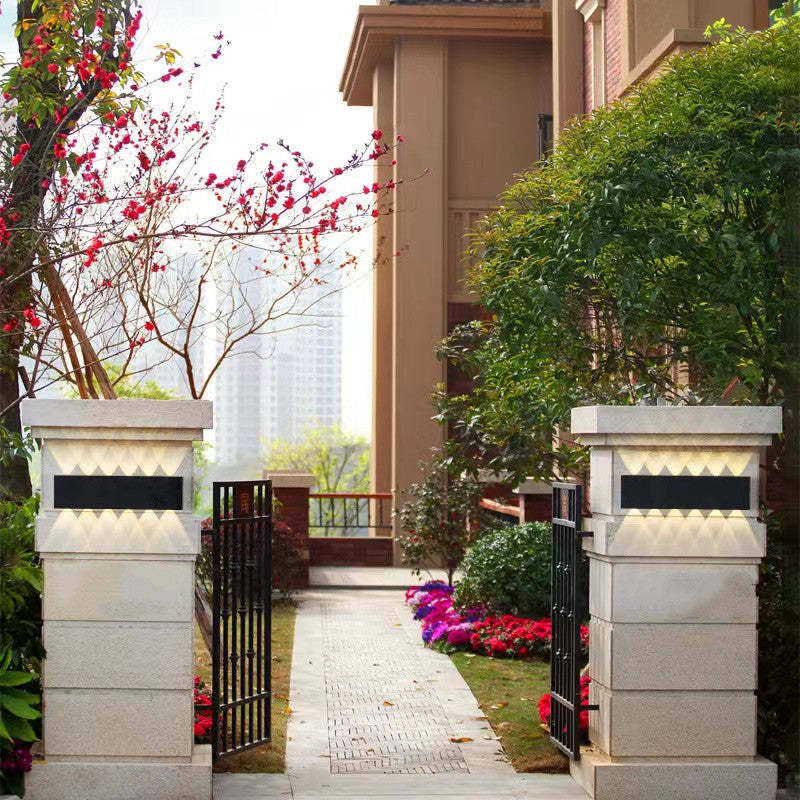 Orr modern outdoor wall lamp on stone pillars.