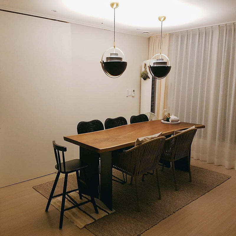 Modern pendant lights over dining table, interior decor