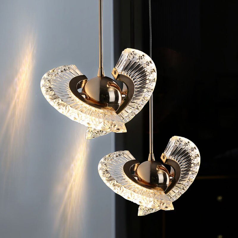Luxury pendant light, gold metal and crystal, fan-shaped design.