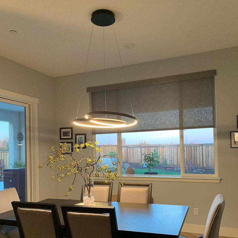Arisha pendant light above dining table. Modern lighting by Las Sola.