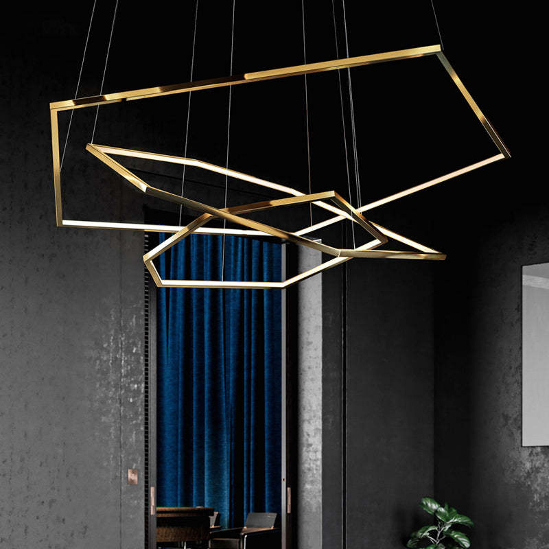 Geometric gold pendant light fixture in a modern interior