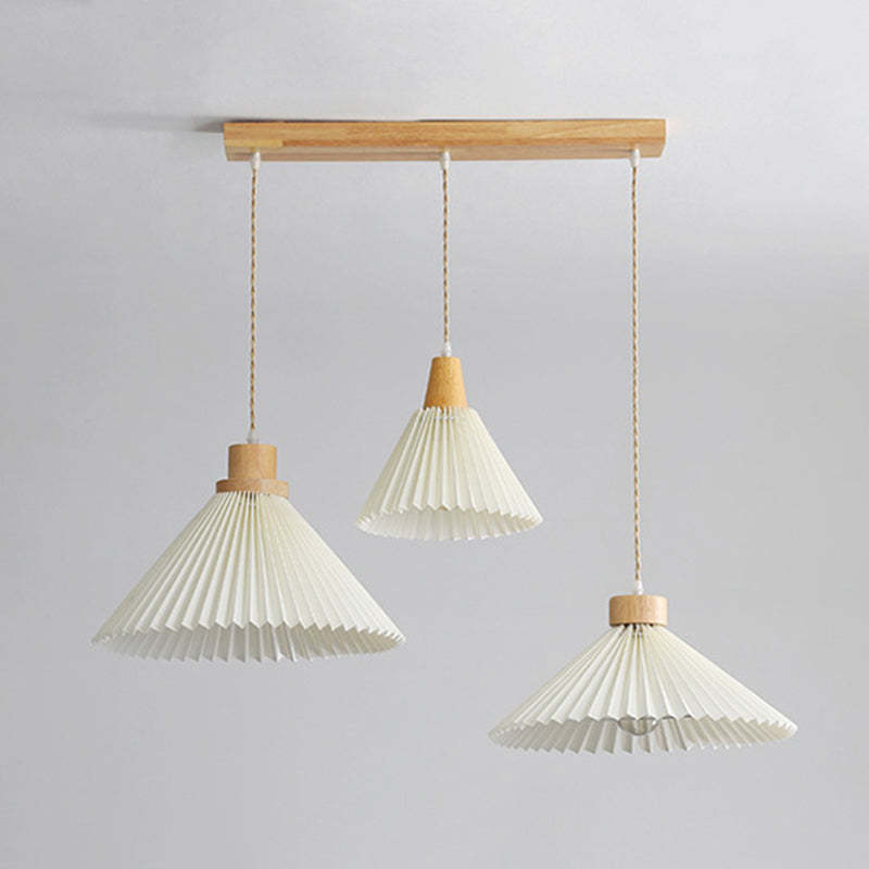 Three Ozawa wood pendant lights with origami shades.
