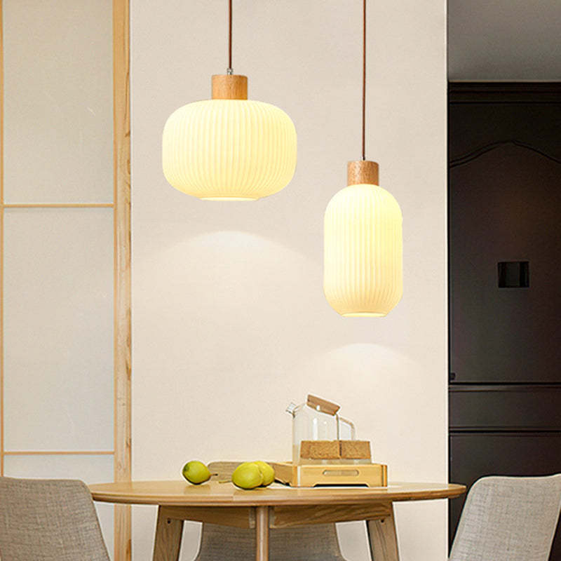 Ozawa modern glass pendant light in dining setting Ozawa Modern Wood Glass Pendant Light