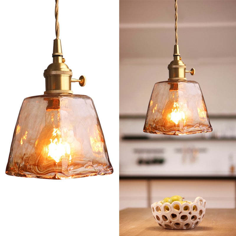 Levy industrial pendant light with caramel glass shade.