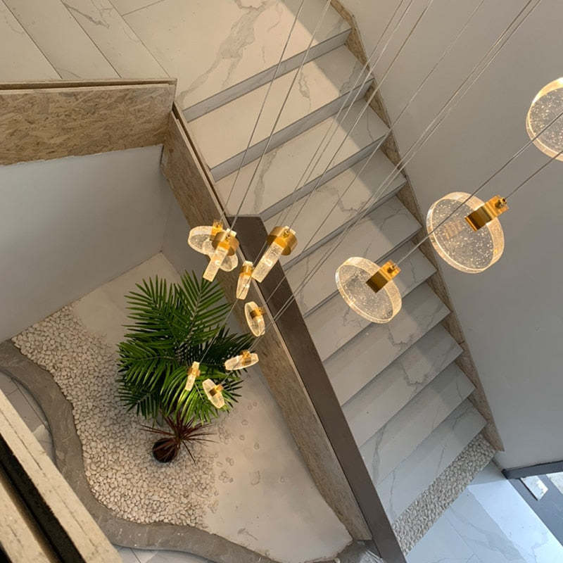 Kristy Chandelier illuminating a staircase, modern home decor