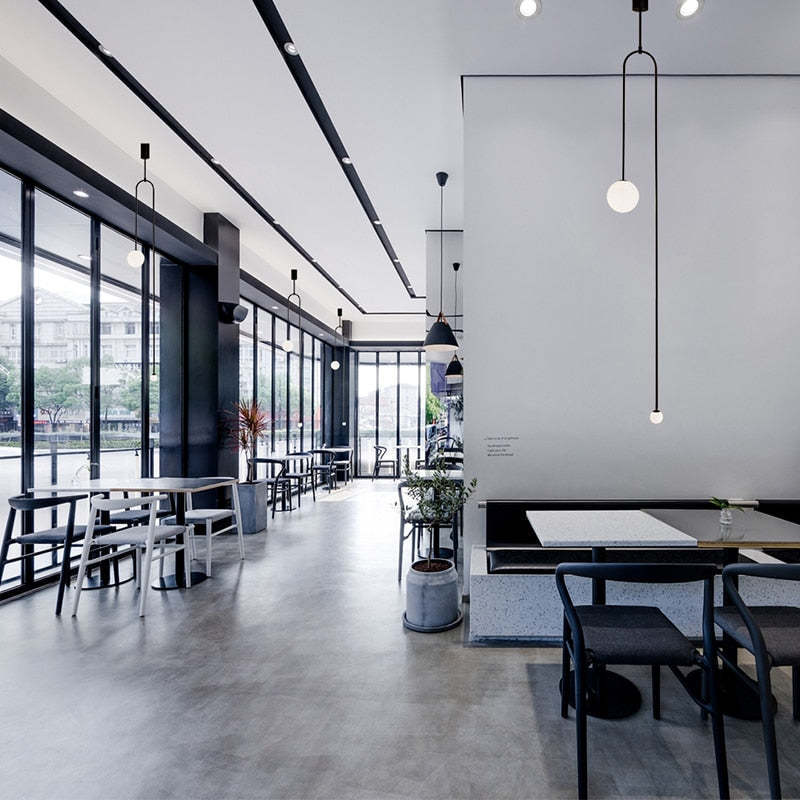 Cafe with Avi minimalist metal pendant lighting by Las Sola