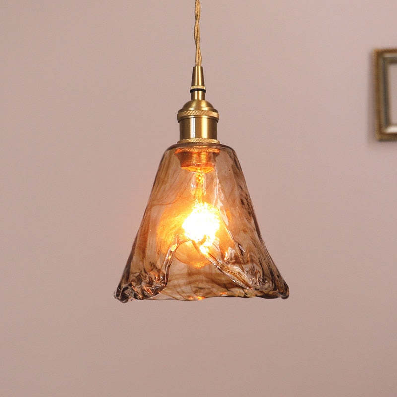 Levy pendant light with caramel glass shade.