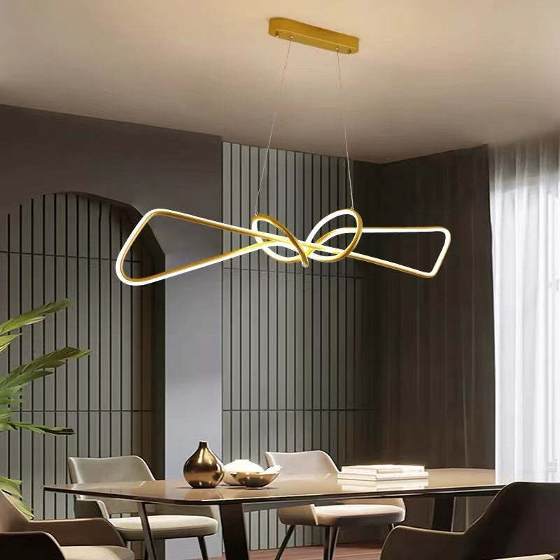 Geometric pendant light in modern dining room.