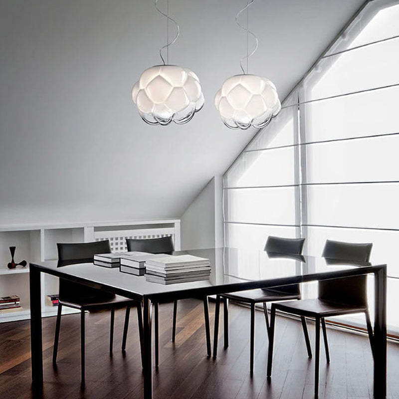 Modern cloud glass pendant lights over dining table