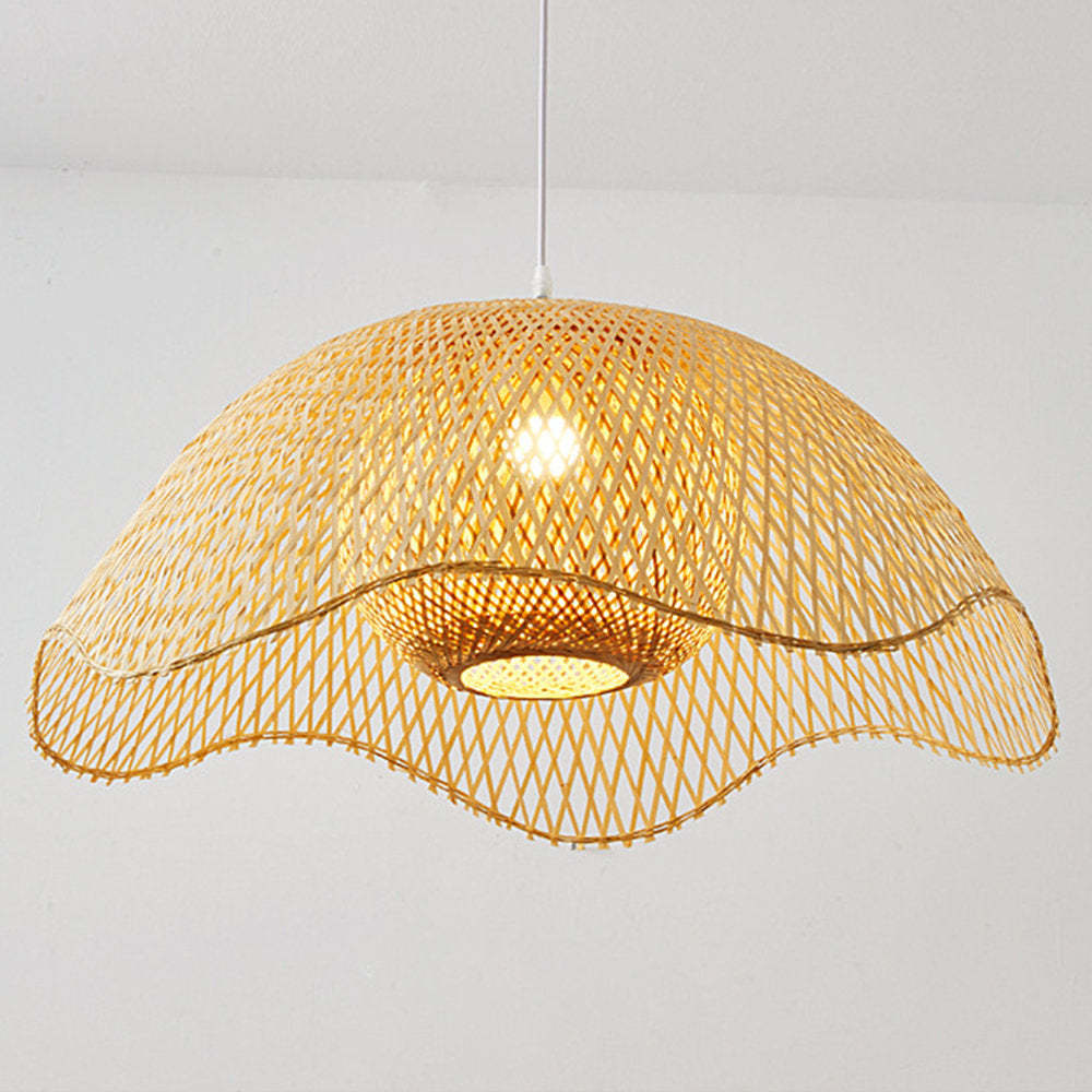 Woven bamboo pendant light with exposed bulb, warm lighting.