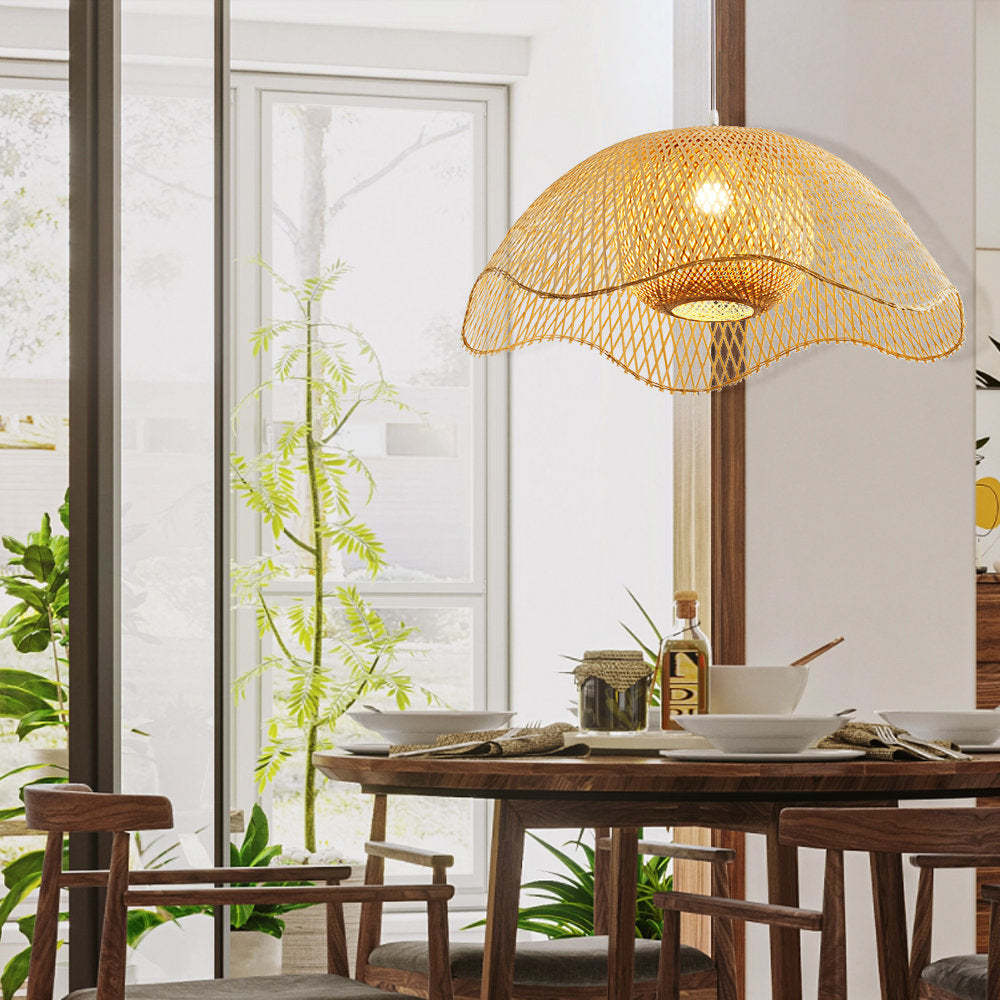 Bamboo pendant light over dining table with dining set