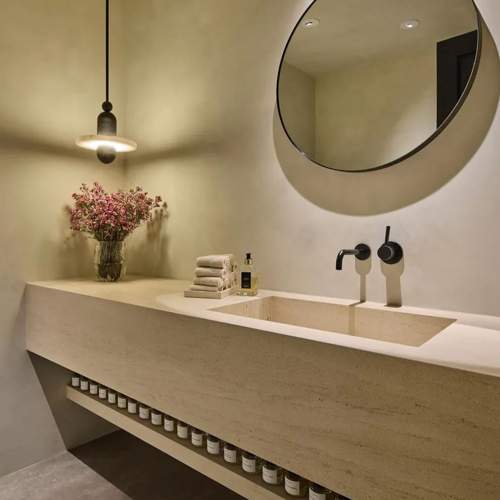 Modern bathroom with Valentina pendant light, stone sink, and mirror