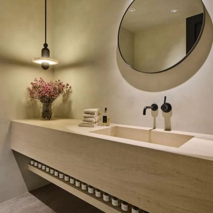 Modern bathroom with Valentina pendant light, stone sink, and mirror