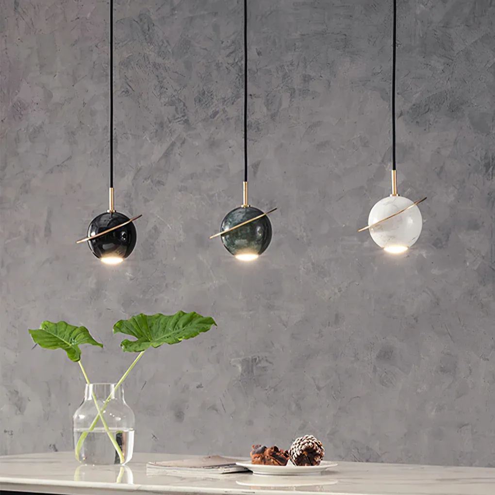 Valentina sphere marble pendant lights over dining table