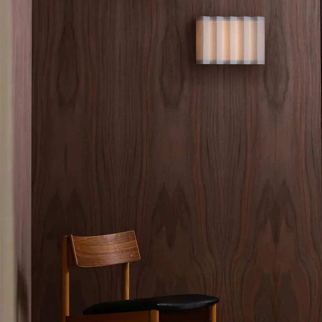 Renee Wall Lamp, chair and wood paneling. Ideal for bedroom lighting
