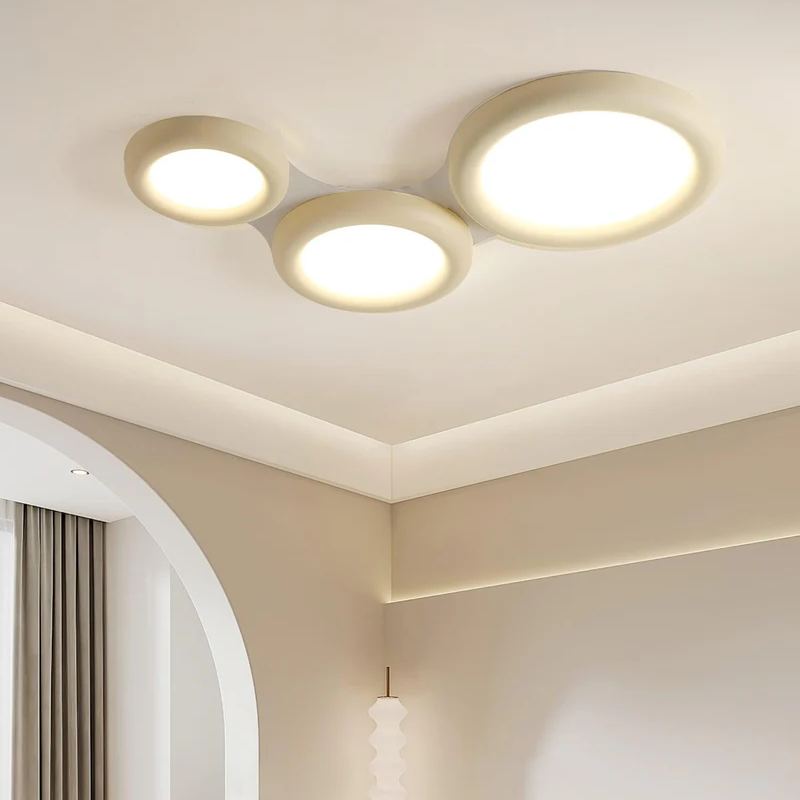 Modern round LED ceiling light in a bedroom