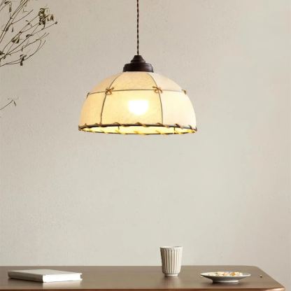 Vintage round pendant light over dining table