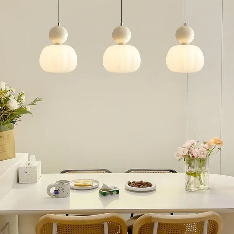 Modern Hailie pendant lights over a dining table