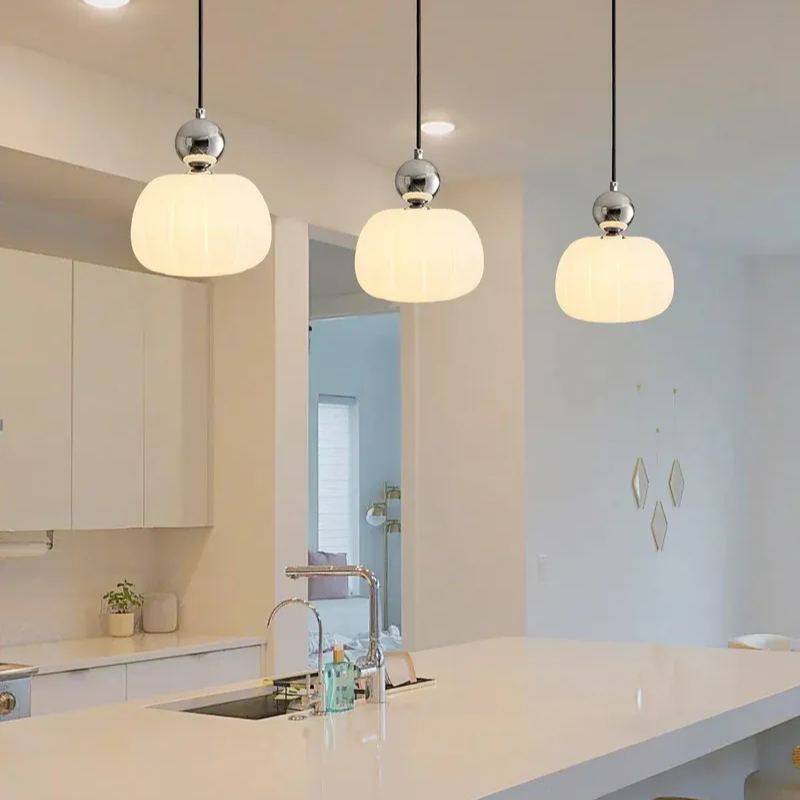 Modern pendant lights over kitchen island