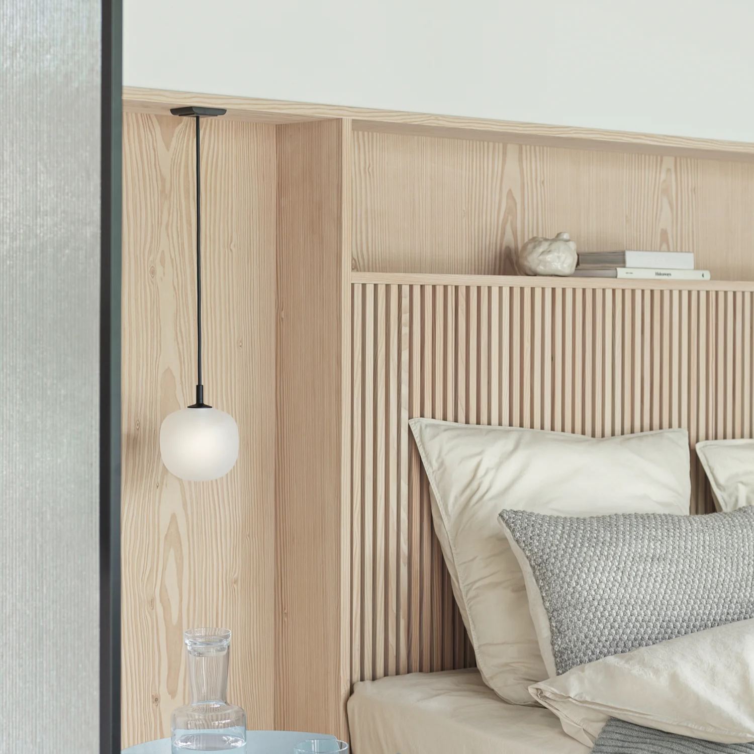 Modern bedroom with Hailie pendant light and wooden headboard