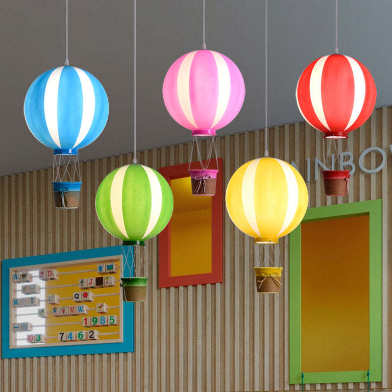 Colorful hot air balloon pendant lights in a kids bedroom