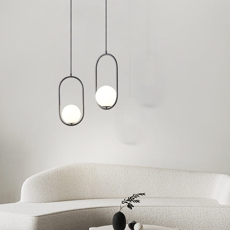Modern black and white Valentina pendant lights over sofa