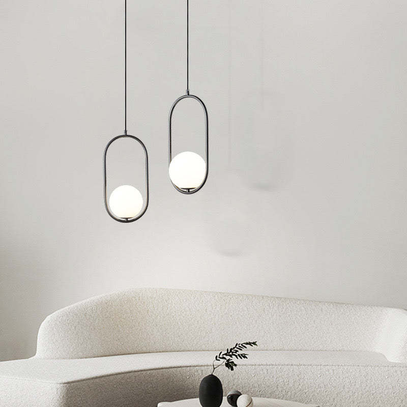 Modern black and white Valentina pendant lights over sofa