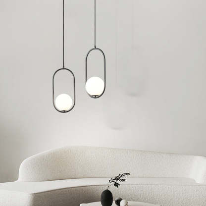 Modern black and white Valentina pendant lights over sofa